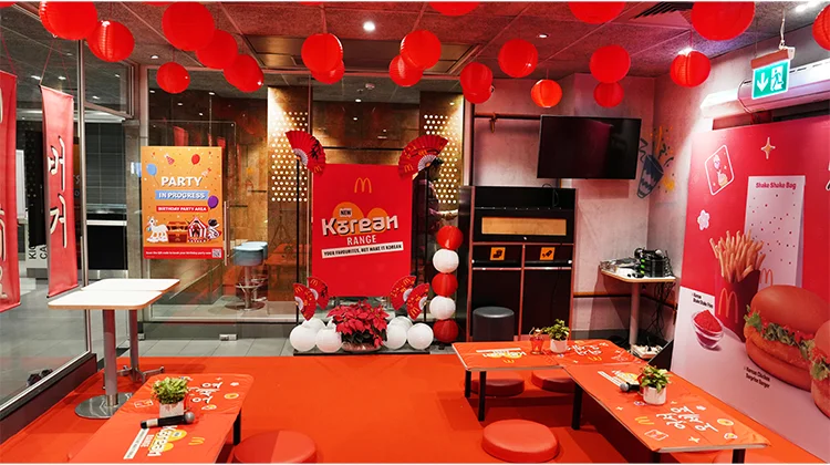 Occtacare, a leading experiential marketing agency, orchestrated a vibrant launch event for McDonald's India’s new Korean Range at the Atria Mall outlet in Worli. This immersive one-day event celebrated the essence of Korean culture while introducing McDonald's latest menu innovations to an enthusiastic audience. An Immersive Korean Experience The launch event was meticulously designed to transport guests into a lively Korean-inspired ambiance. Occtacare infused traditional Korean aesthetics with contemporary elements, ensuring that every detail resonated with the vibrant culture. The venue featured traditional Korean plants, ornate lanterns adorning each table, and a stunning display of lanterns hanging from the ceiling. The seating arrangement included low-height tables paired with plush cushions, creating a cozy atmosphere reminiscent of authentic Korean dining experiences. Parrmm Lakhani, Founder of Occtacare, expressed pride in the event's execution, stating, “Our vision was to create an immersive experience that not only showcased McDonald's India’s Korean Range but also celebrated the rich culture behind it. The response from guests and McDonald's has been phenomenal, and we are proud to have delivered an event that resonated with the Korean theme.” Introducing the Korean Range The new limited-time offering (LTO) from McDonald's India features a variety of Korean-inspired menu items designed to cater to the growing interest in Korean culture among Indian consumers. The range includes: Korean McAloo Tikki Burger Korean Chicken Surprise Korean McSpicy Chicken Korean McSpicy Paneer Burger Korean McEgg Burger In addition to these innovative burgers, McDonald's has introduced a Korean Spice Mix, allowing customers to enhance their favorite fries and chicken nuggets with a burst of flavor. The refreshing Korean Yuzu-Pop beverage complements the spicy flavors and rounds out the authentic dining experience. Celebrating K-Culture The launch event highlighted the increasing influence of K-culture in India, driven by the popularity of K-Pop, K-Dramas, and K-Beauty. Arvind RP, Chief Marketing Officer of McDonald's India (West & South), emphasized this cultural connection by stating, “Korean culture has been having a significant impact on Indian consumers, from music and fashion to food. With our new Korean range, we are bringing that authentic experience to life through taste.” The event not only showcased the new menu items but also aimed to engage attendees in an interactive celebration of Korean culture. Guests were encouraged to immerse themselves in various activities that highlighted traditional aspects of Korea while enjoying the new offerings. Future Prospects As McDonald’s India continues to innovate its menu offerings, this launch reflects the brand's commitment to staying relevant in an ever-evolving culinary landscape. By embracing global food trends and incorporating them into its menu, McDonald’s aims to attract both casual diners and dedicated fans of Korean cuisine. The success of this launch event positions McDonald’s India as a key player in bringing international flavors to local consumers while enhancing their overall dining experience. With plans for further expansions in their menu inspired by global trends, McDonald’s is set to keep delighting its customers with exciting new tastes. Conclusion Occtacare's successful orchestration of the launch event for McDonald's India’s Korean Range at Atria Mall not only introduced exciting new menu items but also celebrated the rich cultural heritage of Korea. As consumer interest in K-culture continues to rise, McDonald’s is poised to leverage this trend through innovative offerings that resonate with Indian diners. Credit: This article is based on information from Economic Times, Mid-Day, BW Hotelier, Indian Retailer, and CNBC-TV18. Summary Occtacare orchestrated a vibrant launch event for McDonald's India's new Korean Range at Atria Mall. The limited-time offering includes various Korean-inspired menu items like burgers and beverages. The event celebrated K-culture's influence on Indian consumers while engaging guests in an immersive experience. McDonald’s aims to attract diverse consumers by embracing global culinary trends.